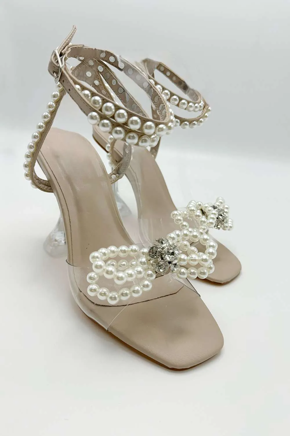 Pearlie Perspex Faux Pearl Bow Detail Heeled Sandals in Nude